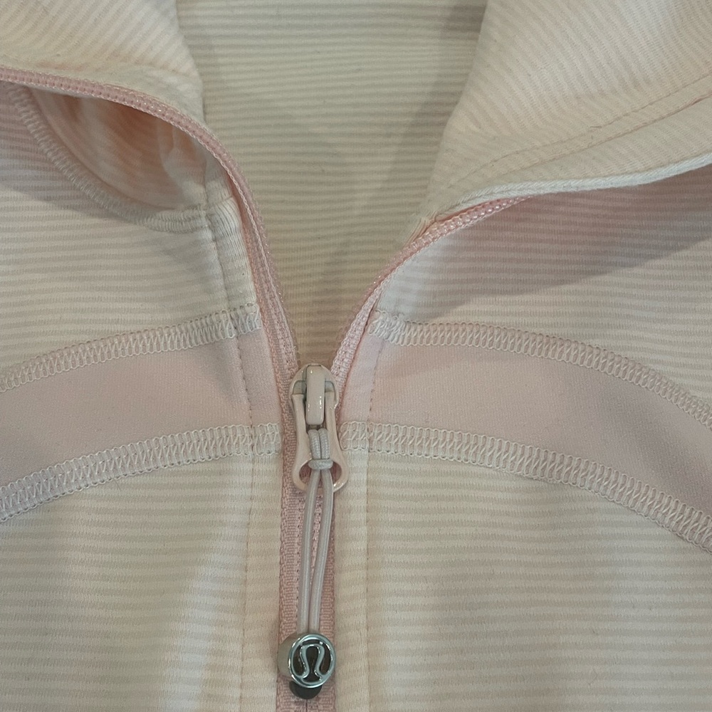Lululemon stretchy zip up, pale pink stripes, sz 10. Like new condition.